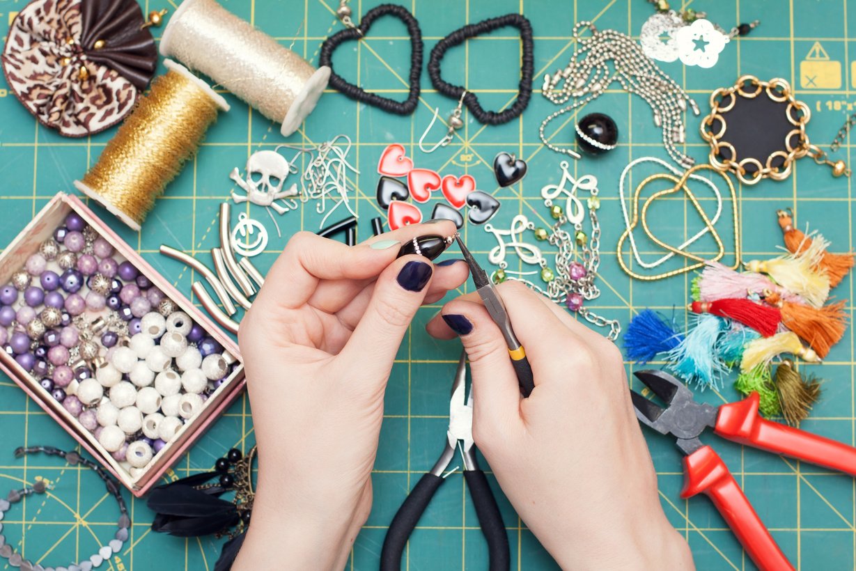 Woman making costume  jewelry, earrings